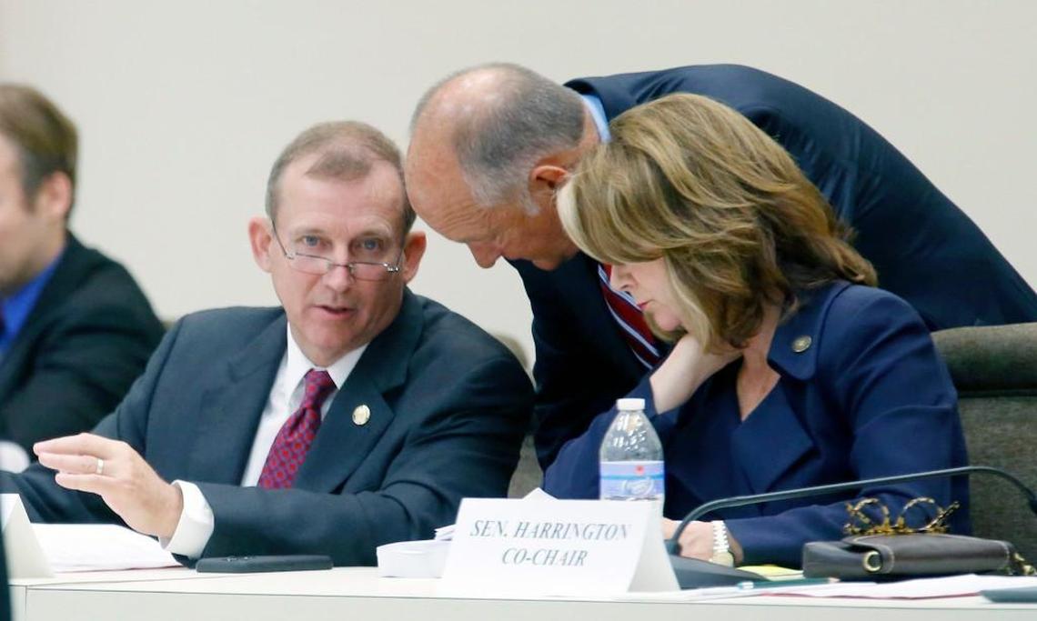 Sen. Harry Brown, left, Sen. Brent Jackson, center, and Sen. Kathy Harrington confer during the Senate appropriations committee meeting on Tuesday, June 16, 2015 at the Legislative Office Building in Raleigh.