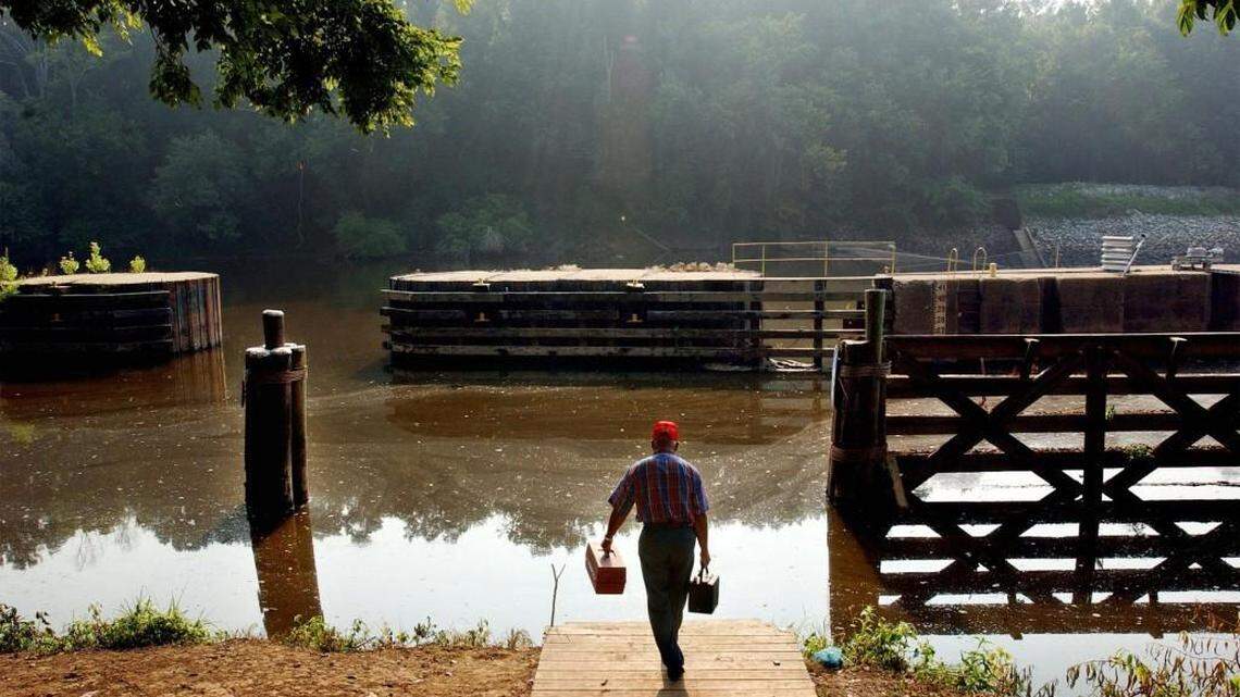 Billy Locklear, from Robeson County, brings his tackle box to the shores of the Cape Fear River at the William O. Huske Lock and Dam in 2004. A Chemours Co. plant near Fayetteville has admitted to dumping GenX into the river that provides the drinking water for much of southeastern North Carolina.