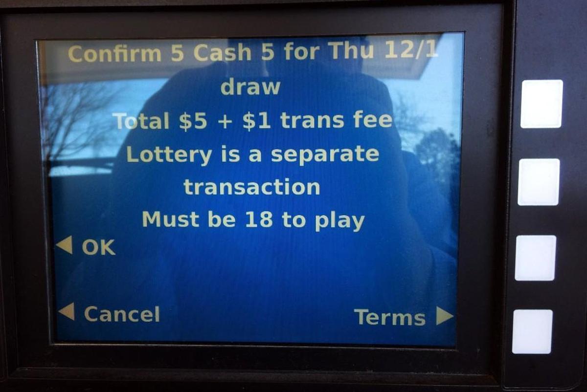 A Play at the Pump lottery screen on a pump at the Eagles Gas Station on Tryon Road in Raleigh.