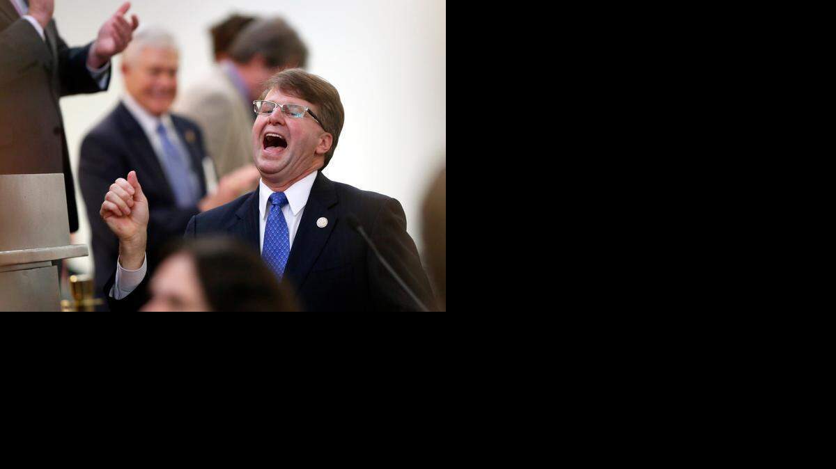 
N.C. Chief Justice Mark Martin enters the House Chambers before delivering a State of the Judiciary address before the N.C. General Assembly on Wednesday, March 4, 2015 at the Legislative Building in Raleigh. Chief Justice Martin delivered the first State of the Judiciary address since 2001.
