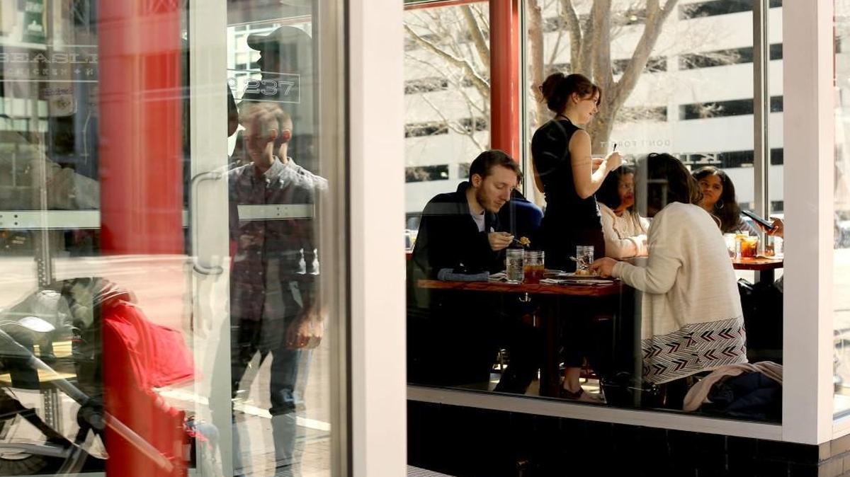 Guests enjoy brunch at Beasley's Chicken + Honey in downtown Raleigh last month.