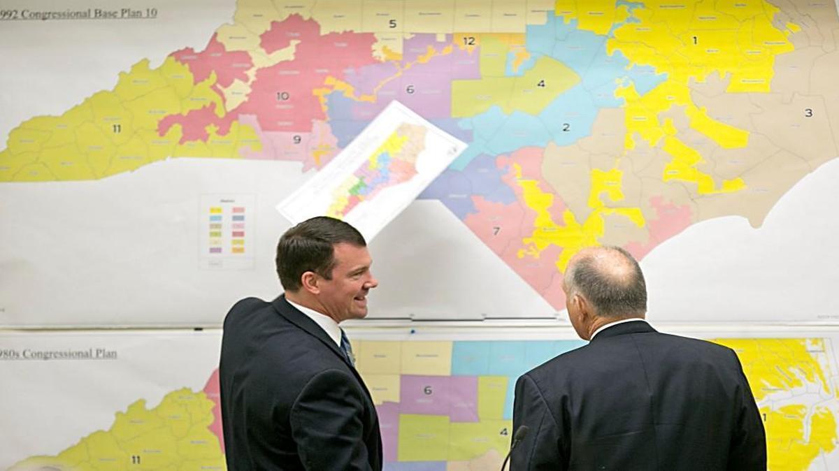 NC lawmakers say they might have to change 119 of the state’s 170 legislative districts to correct racial gerrymanders. In 2016, Senators Dan Soucek, left, and Brent Jackson, right, review historical maps during a General Assembly session on Tuesday, February 16, 2016.