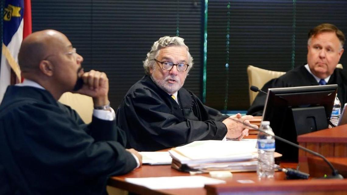 A three-judge panel of L. Todd Burke, left, Jesse Caldwell, center, and Jeffrey Foster would have ruled against Gov. Roy Cooper in his challenge of a revamp of the elections board and ethics commission. The judges heard arguments at Campbell Law School on June 1, 2017.