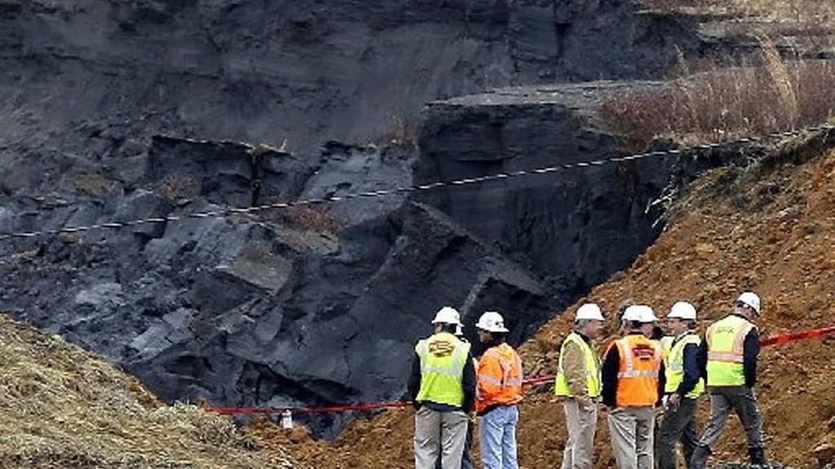 Officials survey the Dan River coal ash basin that failed in 2014 near Eden, N.C.
