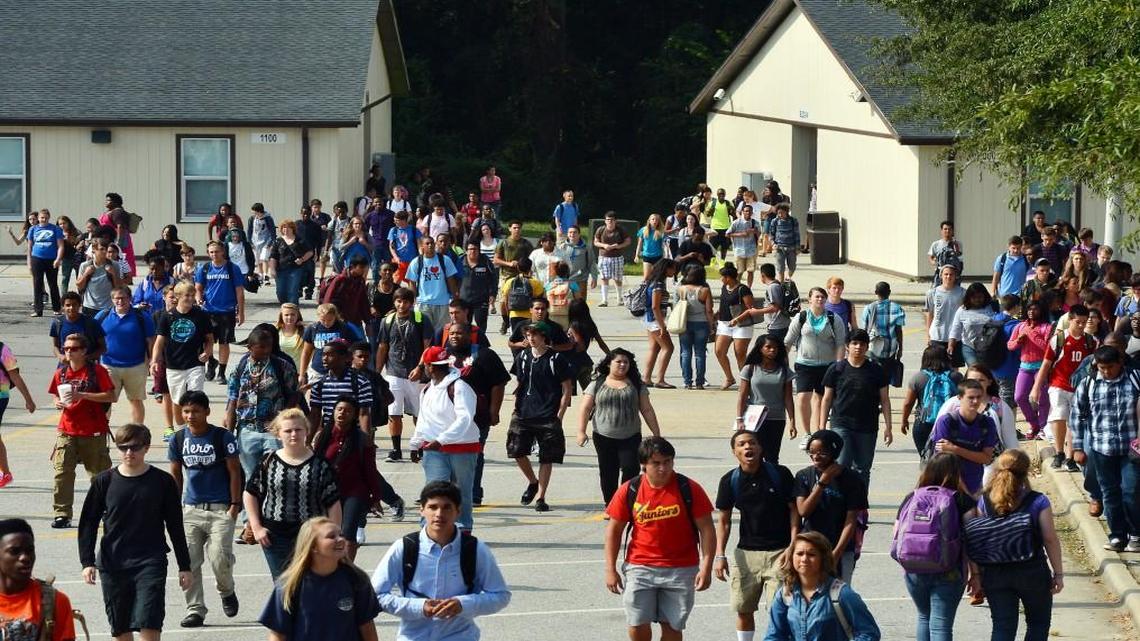 Students at Garner High School walk from modular classroom structures as they change classes Thursday August 28, 2013. The N.C. House has passed a bill that would form a committee to study how to divide North Carolina school districts.