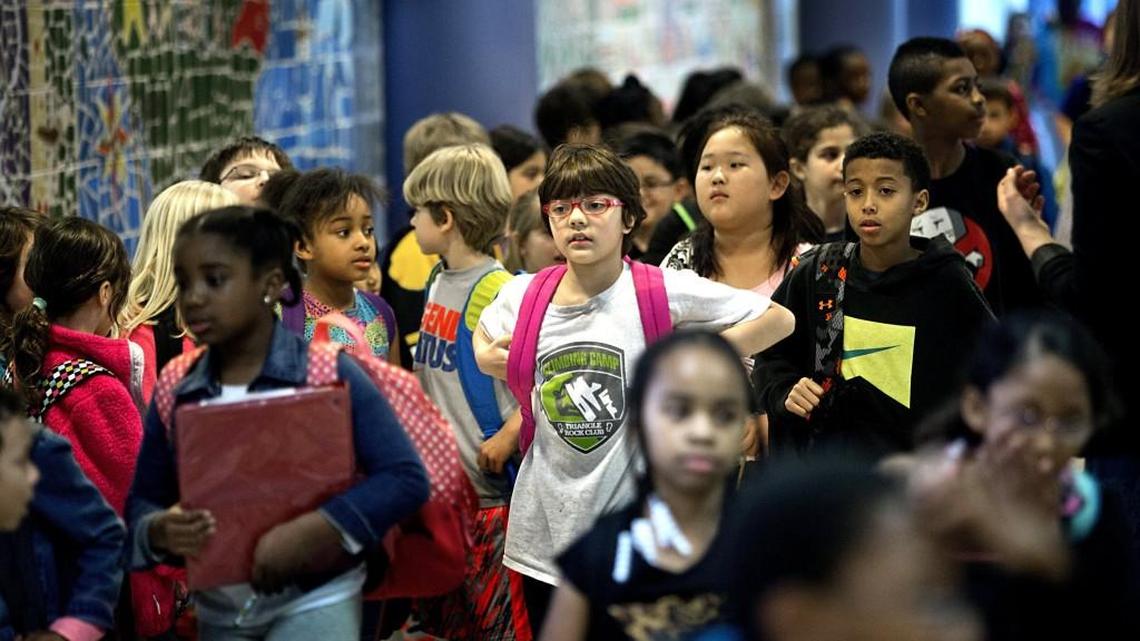 Brier Creek Elementary School students fill the hallways of the overcrowded school on March 11, 2015. A state legislative study committee will begin looking at the best ways to break up North Carolina school districts.