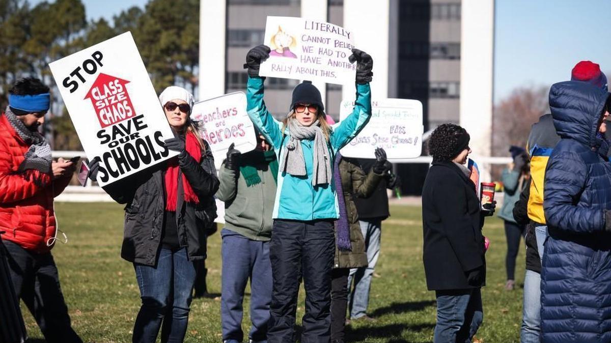 Despite the bitter cold, hundreds of parents, educators and students held signs, chanted, and listened to a variety of speakers at the Class Size Chaos Rally on Halifax Mall in Raleigh, N.C., on Jan. 6, 2017. Republican lawmakers have introduced legislation to delay the K-3 class size changes but have linked it to changes involving the Atlantic Coast Pipelline fund and membership on elections boards.