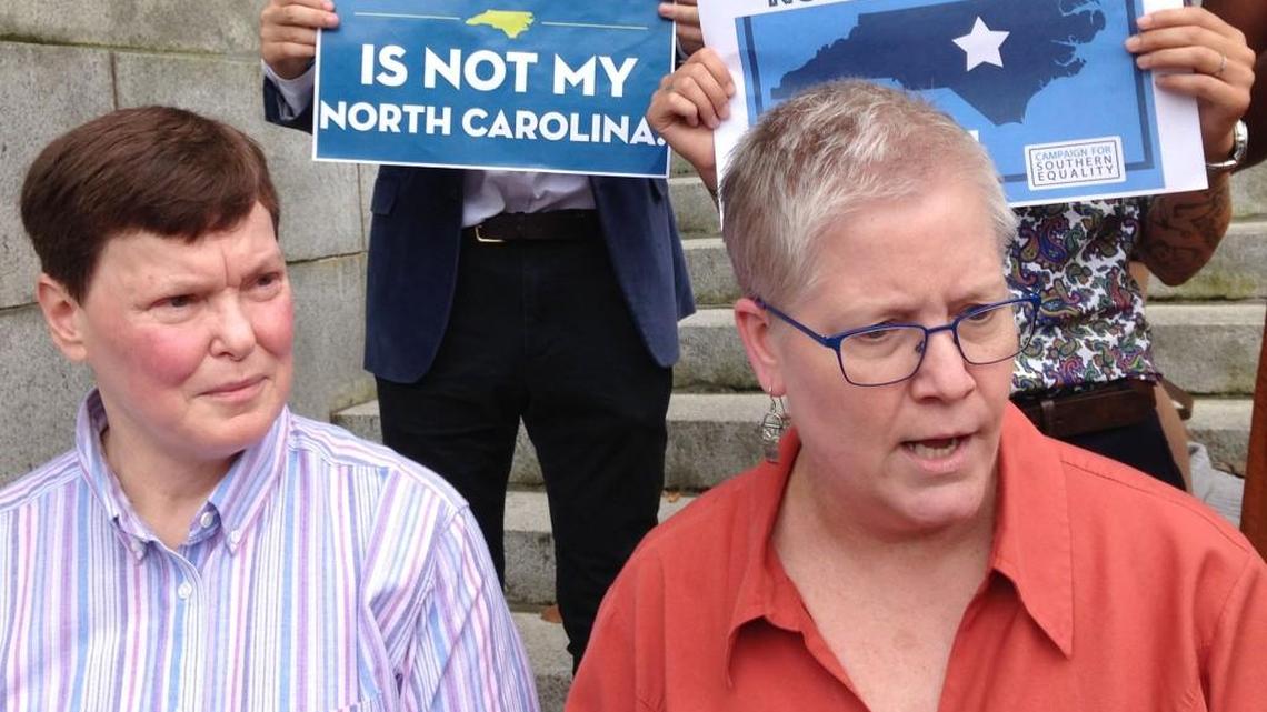 Diane Ansley, left and her spouse, Cathy McGaughey, right, talk in August 2016 about their challenge to North Carolina's law allowing magistrates to opt out of performing gay marriages for religious reasons.