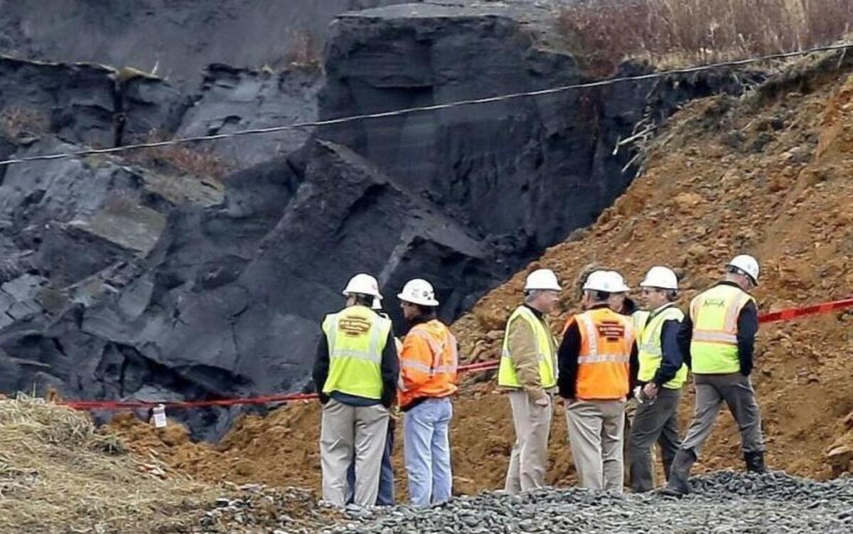 Duke Energy engineers and contractors survey the site of a coal ash spill at the Dan River Power Plant in Eden, N.C. as state and federal environmental officials continued their investigations of the spill into the river. A legislative oversight committee has called for officials from the N.C. Department of Environment and Natural Resources to appear at a hearing on Monday, Feb. 17, 2014 to talk about the spill. North Carolina lawmakers State Senate Rules Chairman Tom Apodaca and House Environment Committee Vice-Chairman Chuck McGrady say they will co-sponsor a bill seeking the removal of coal ash dumps like the one that ruptured Feb. 2. (AP Photo/Gerry Broome, File)