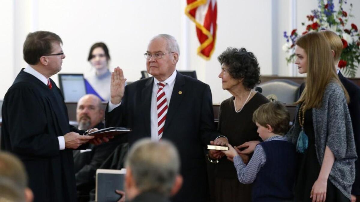 Supreme Court Justice Mark Martin, left, administered the oath of office to Sen. Louis Pate when he was sworn as the Deputy Senate President Pro Tem at the start of the General Assembly’s session on Jan. 11, 2017