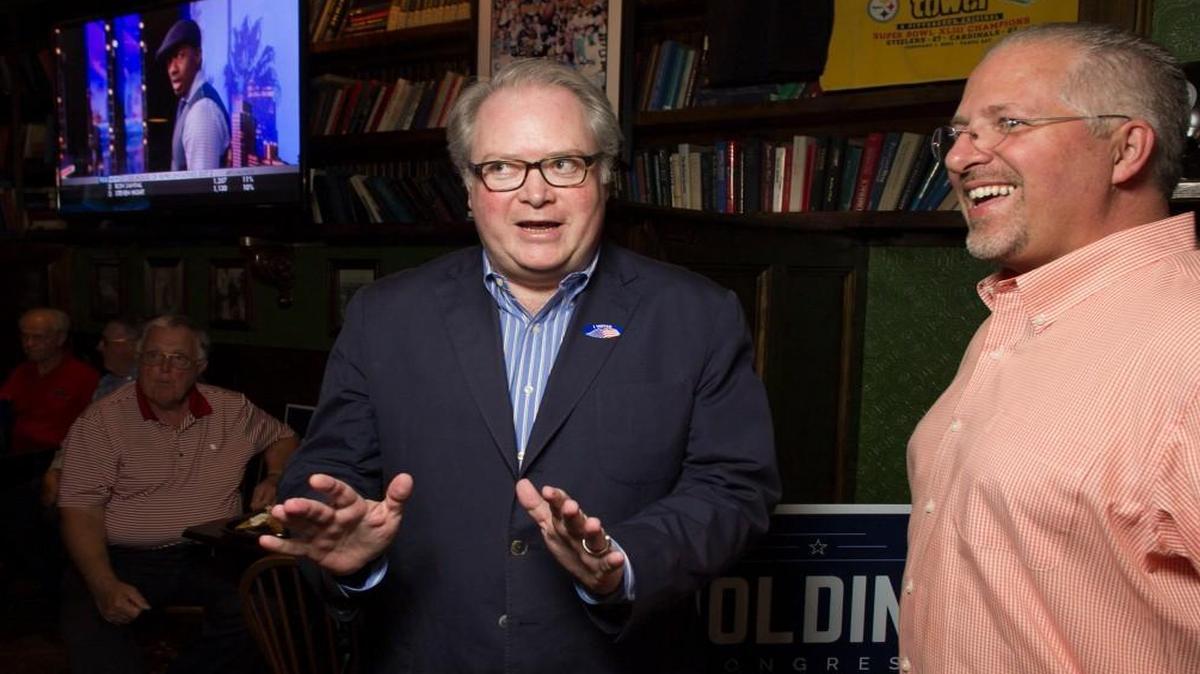 Congressman George Holding talks with Duane Cutlip upon his arrival on Tuesday, June 7, 2016 at the Hibernian in Raleigh, N.C.