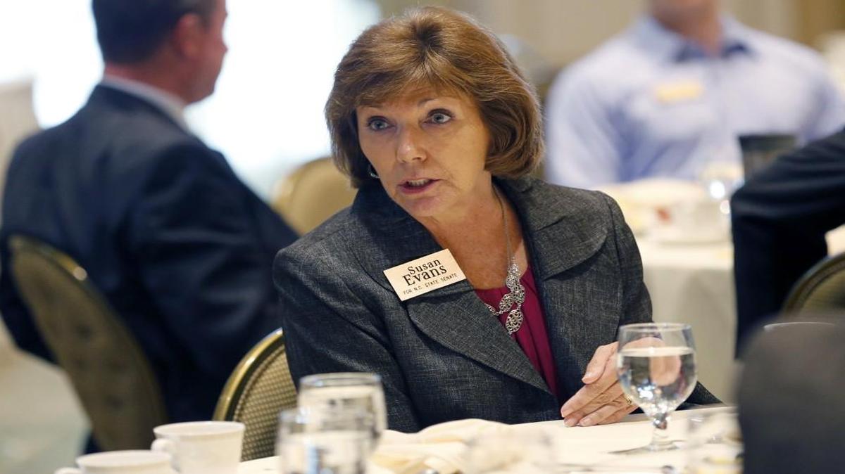Susan Evans, a Democrat who is running for the N.C. Senate, talks with attendees at a forum for candidates for state legislative races held at Prestonwood Country Club in Cary, NC, on Sept. 28, 2016.