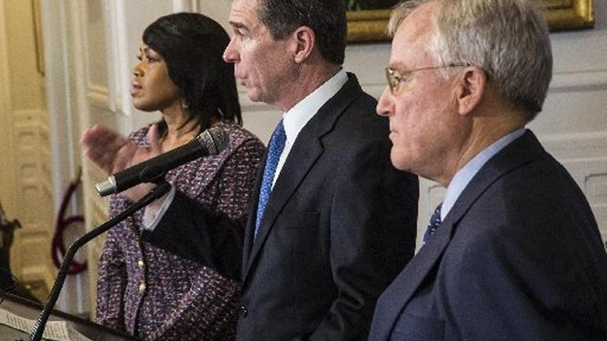 Gov. Roy Cooper, center, named Tony Copeland, right, to lead the Department of Commerce last year. Copeland, who is helping lead the state's chase for Amazon's HQ2, was coy about whether Amazon officials recently visited the Triangle.