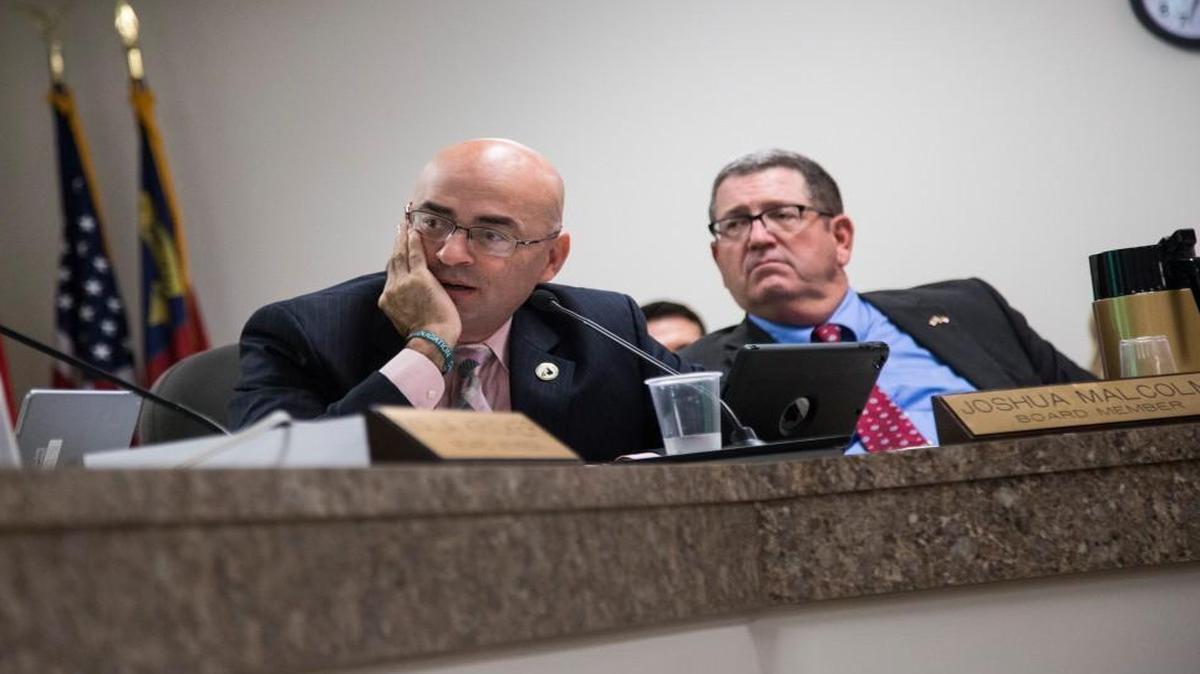 State Board of Elections members Joshua Malcolm, left, and A. Grant Whitney Jr. during a meeting Thursday, September 8, 2016 at the State Board of Elections in Raleigh. A law reinstated by the Court of Appeals Thursday would replace the board.