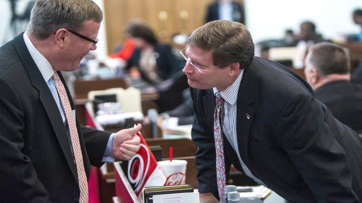 
House Speaker Tim Moore, left, gives a thumbs-up to Rep. Nelson Dollar, a Republican from Cary and house chief budget writer, before a vote on the state budget bill in the House chambers Thursday.
