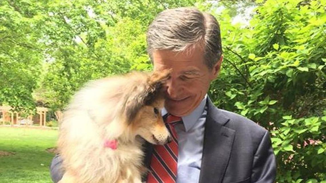 Gov. Roy Cooper with Chloe the dog, who died Monday