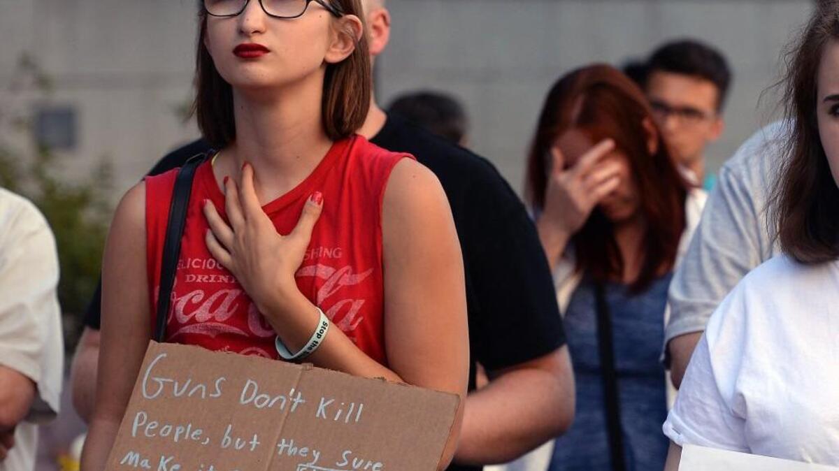 Cya Woodard, of Elm City, N.C. listens to speakers during a Moral Monday memorial service for victims of the Orlando massacre at the Bicentennial Mall in Raleigh, N.C. Monday, June 20, 2017. About 150 people attended the rally.