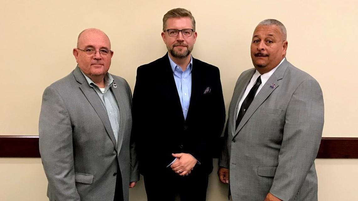 Former SEANC Executive Director Robert Broome, center, poses shortly after his hiring in December 2017 with his predecessor Mitch Leonard, left, and former SEANC President Stanley Drewery, right.
