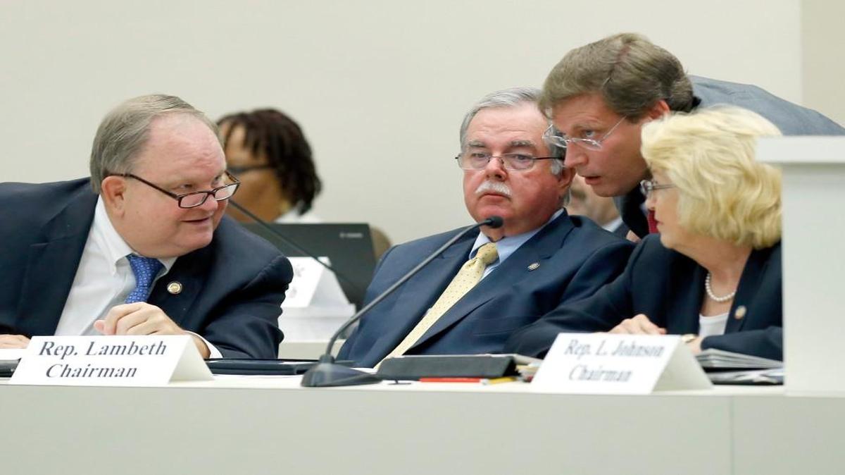 
Senior budget writer Nelson Dollar, second from right, confers with other budget committee chairs Rep. Chuck McGrady, left, Rep. Donny Lambeth, second from left, and Rep. Linda Johnson. Dollar wouldn’t say if he’s reached an agreement with the Senate on spending levels but said “negotiations are ongoing.”
