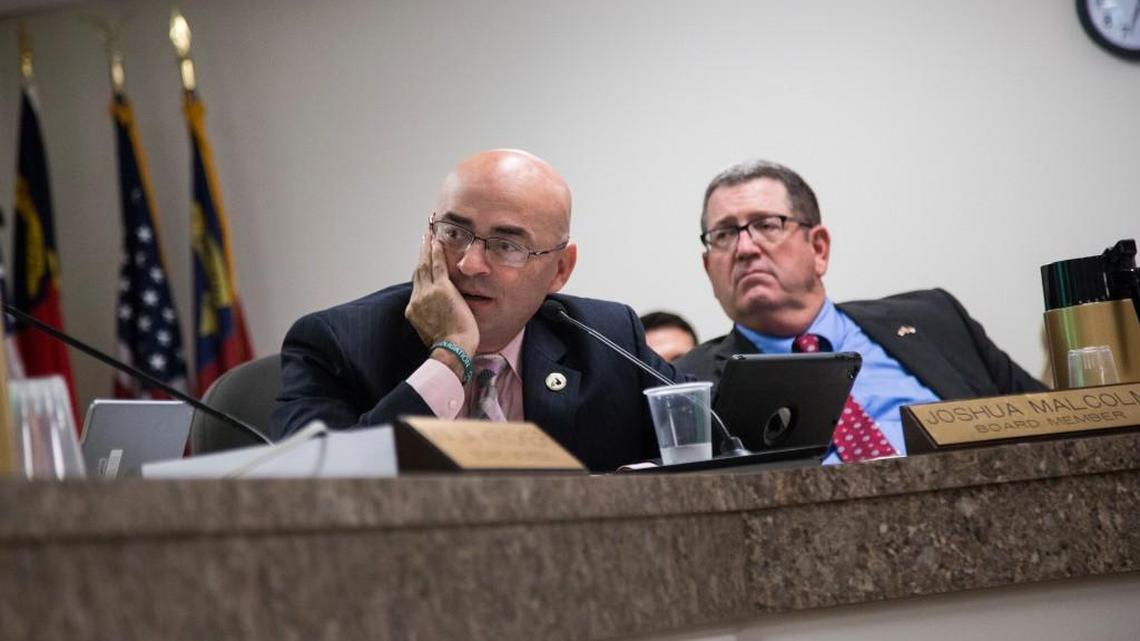 State Board of Elections members Joshua Malcolm, left, and A. Grant Whitney Jr. discuss early voting during a meeting Sept. 8, 2016, in Raleigh.