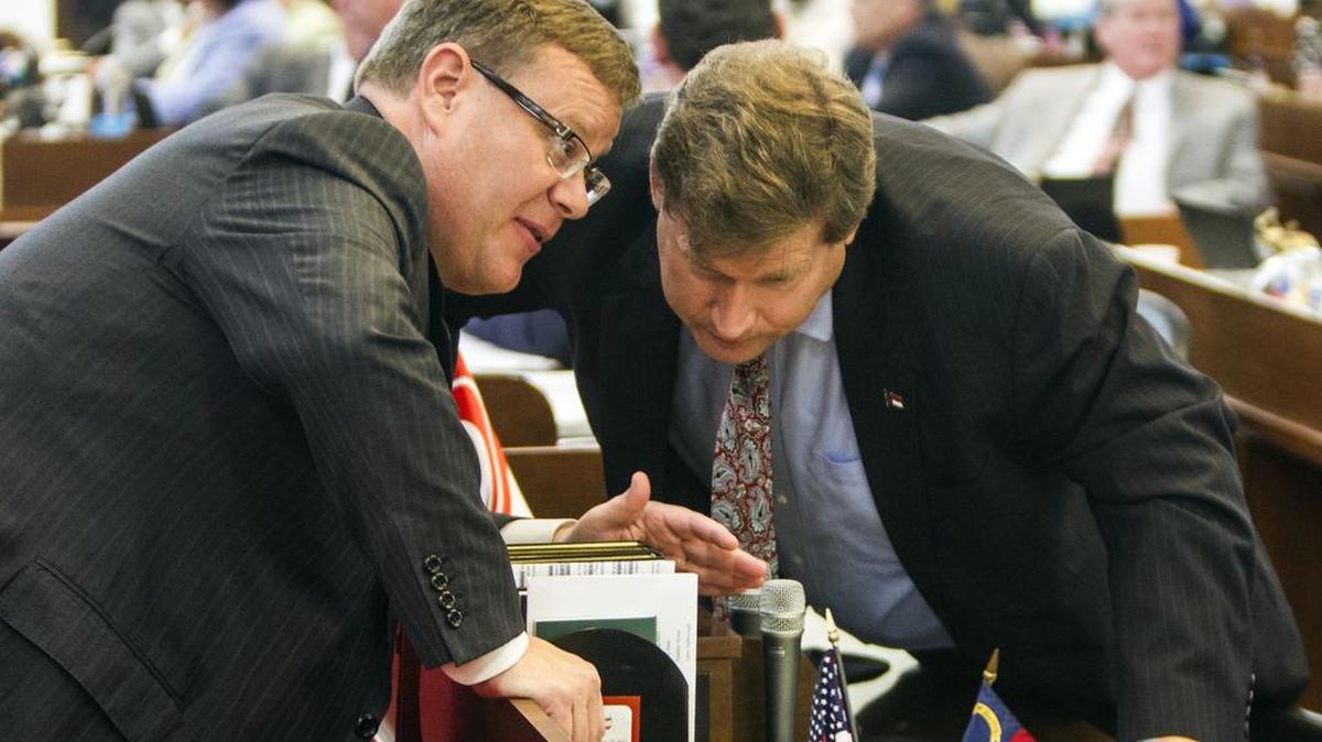 
Speaker Tim Moore, left, huddles with Rep. Nelson Dollar, a Cary Republican, during a House session last week.  Moore has charted a more bipartisan, centrist path than Thom Tillis did as speaker, according to voting records and legislators of both parties.
