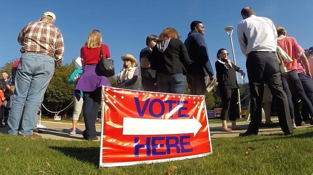 Voters wait in line for early voting at the Lake Lynn Community Center in Raleigh, N.C. Wednesday, October 26, 2016.