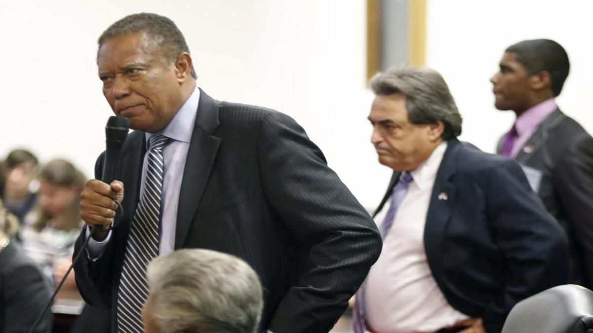 
NC State Senator Dan Blue (D-Wake County), left, stands to plead for more time for senators to read the budget compromise bill before them in the NC Senate Tuesday as fellow State Senator Bob Rucho (R-Mecklenburg County) listens before coming back to his seat in the NC Senate.
