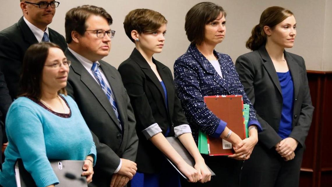 From left, Mark Turner, (background) father of Hallie Turner, attorneys Gayle Tuch and Ryke Longest, 13 year old plaintiff Hallie Turner and Turner's mom, Kelly Turner and attorney Shannon Arata stand before Wake Judge Michael Morgan in Wake County Civil Courtroom 5C November 13, 2015 on a motion to force the state of North Carolina to reduce greenhouse gas emissions. Hallie Turner, 13, is an 8th grader at Raleigh's Ligon Middle School.