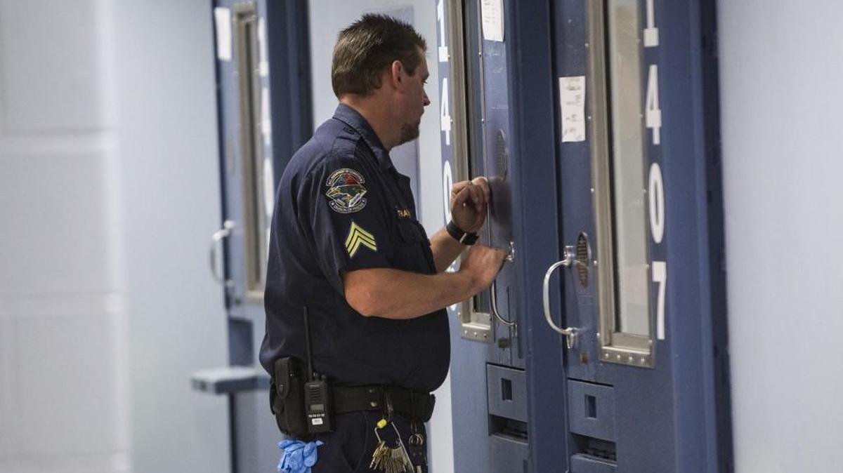 
A corrections officer checks on an inmate August 5, 2015 at Central Prison's new treatment mall in Raleigh.
