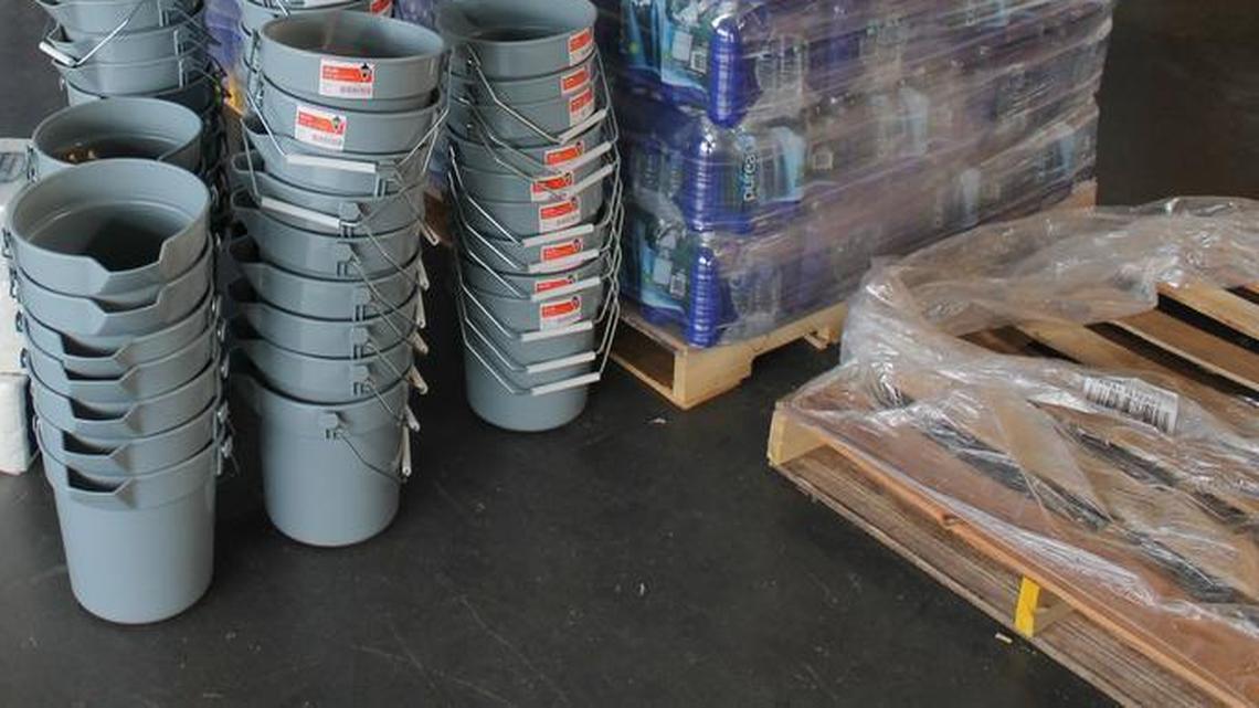 Cases of water, buckets and cleaning supplies await families affected by Hurricane Matthew at the FEMA Disaster Recovery Center in Smithfield in Nov. 2016.
