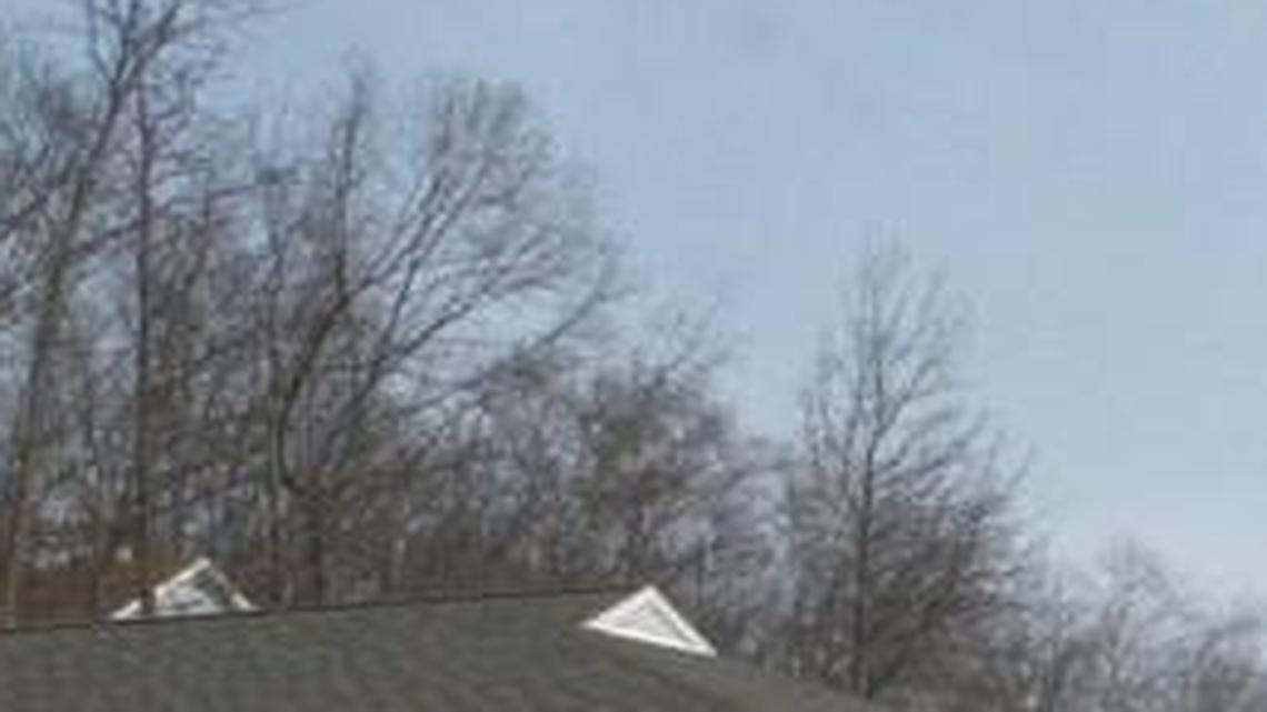 Buxton's Jim Overstreet is among the anglers who find good fishing for largemouth bass on Hyco Lake, a reservoir created to cool the coal power plant in the background.