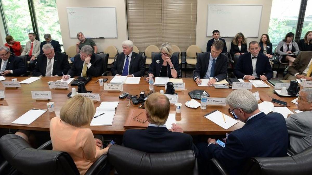 Roll is called as members of the UNC Board of Governors is read prior to the start of a meeting for the board to discuss House Bill 2 in Chapel Hill, N.C. Tuesday, May 10, 2016. The meeting was closed to the public and press after roll was called and the board went into executive session.