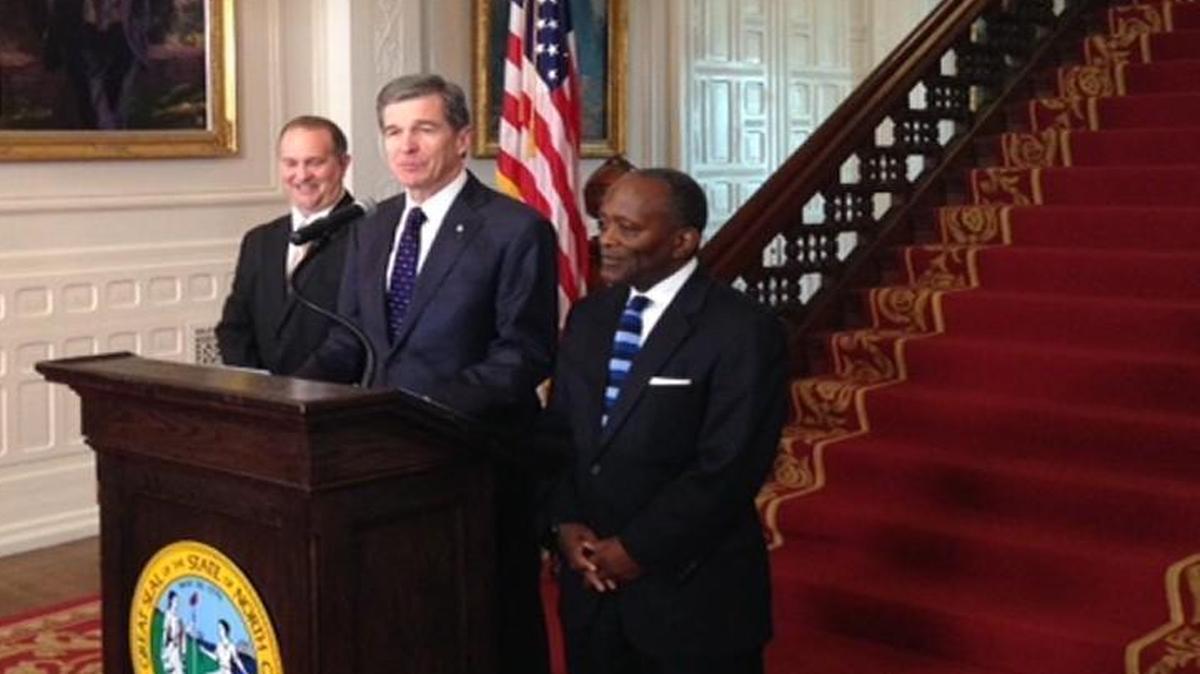 IT Secretary Eric Boyette, Gov. Roy Cooper and Revenue Secretary Ron Penny at the Executive Mansion in Raleigh on Friday.