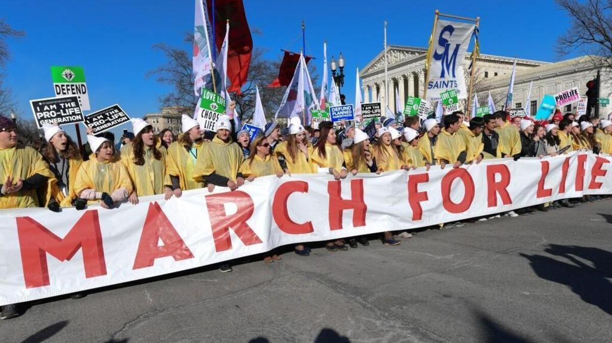 People participate in the March for Life near the Supreme Court in Washington, Friday, Jan. 19, 2018.