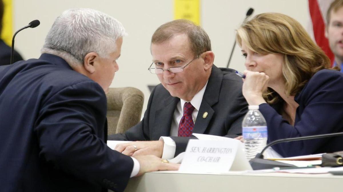 
Sen. Tom Apodaca, left, confers with Sen. Harry Brown, center, and Sen. Kathy Harrington as the state Senate worked on its budget last week. The budget calls for ending healthcare benefits for future state retirees.
