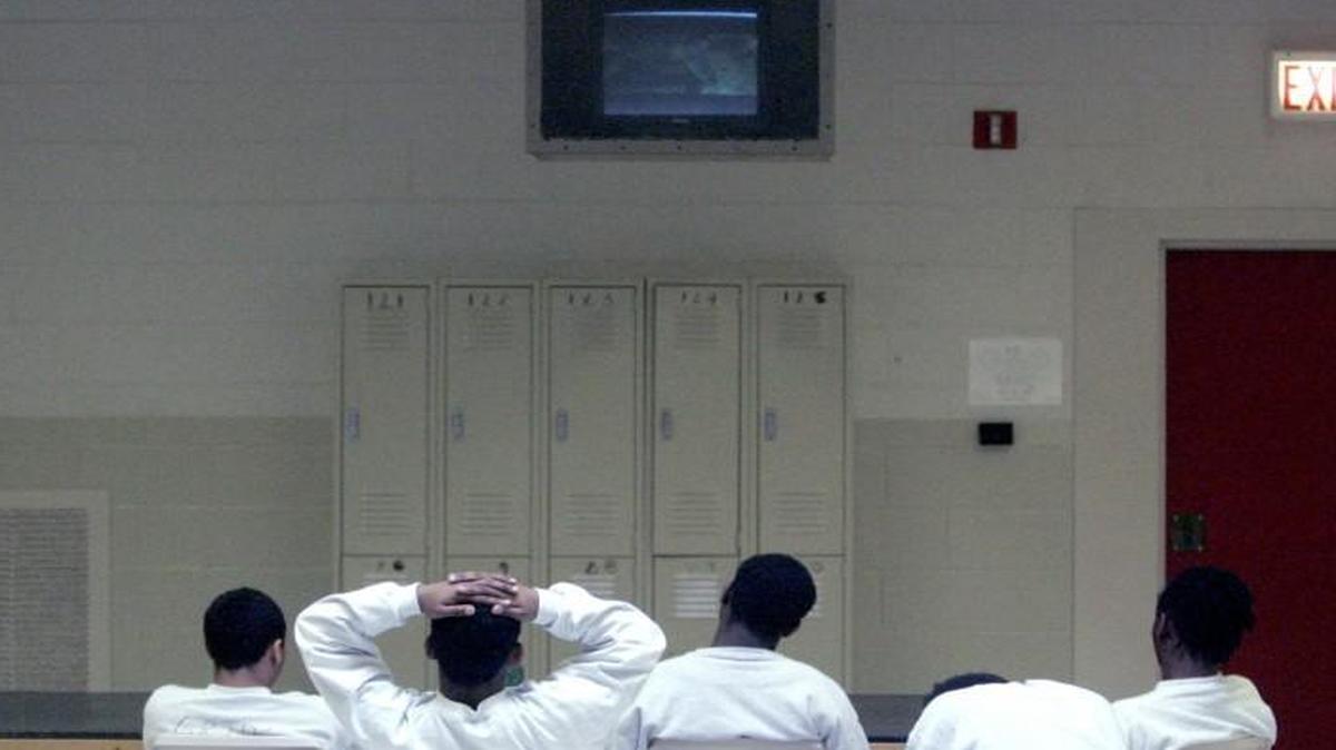 Boys pass time watching television in 2007 at the Polk Youth Institution juvenile detention facility in Butner.