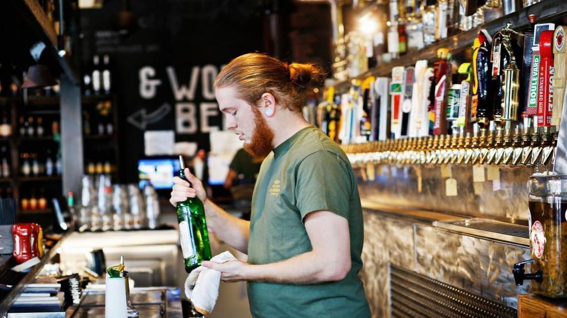 Brier Creek Beer Garden bartender Matt Braswell preps the bar before lunch service on Friday, Oct. 14, 2016.