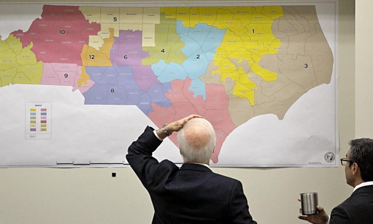 Members of the Joint Select Committee on Congressional Redistricting review historical voting maps at the NC legislature on Feb. 16, 2016.