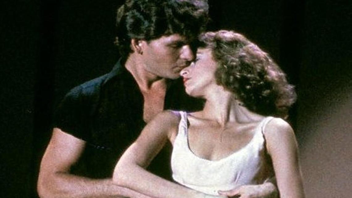 In this image provided by Lionsgate Home Entertainment, Patrick Swayze, portraying Johnny Castle, and Jennifer Grey, portraying Baby Houseman, are shown in a scene from the film, "Dirty Dancing." Lionsgate, which is set to film a remake of the movie in North Carolina, is canceling a comedy production in the state over a new LGBT law.