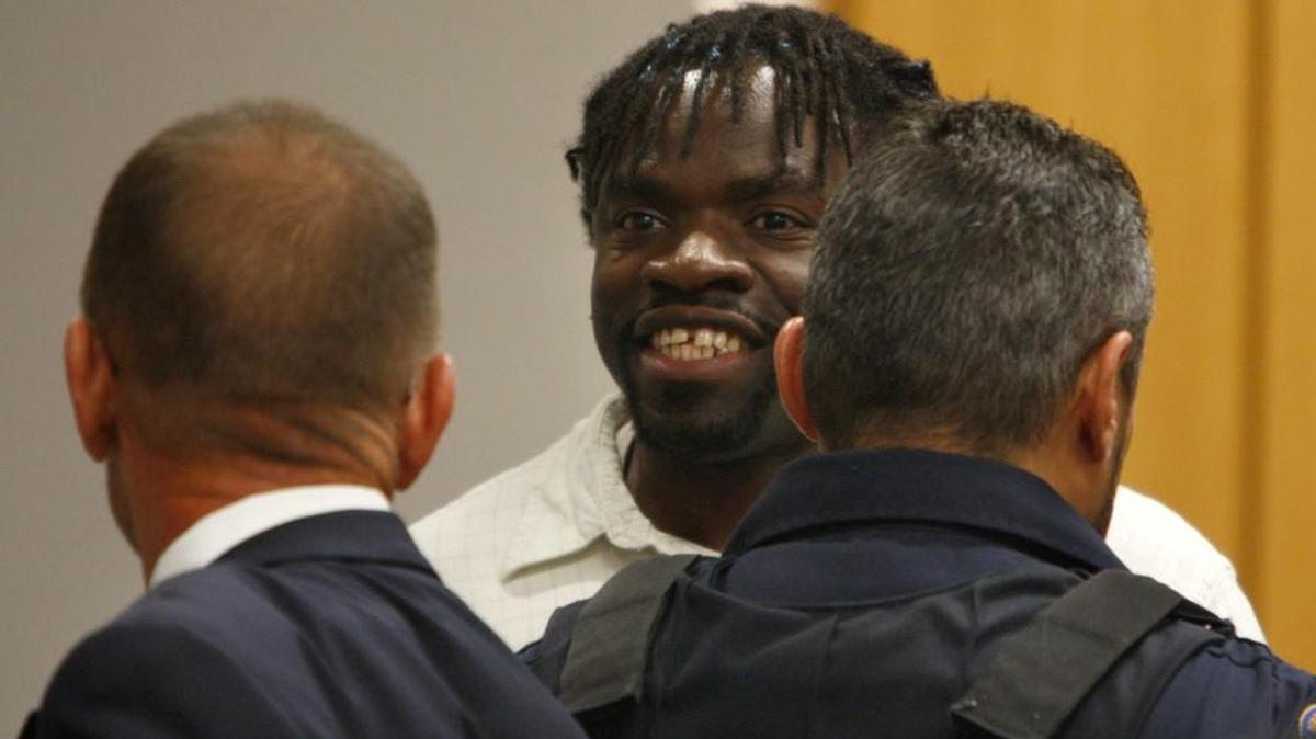 Death row inmate Marcus Robinson smiles towards his family after Cumberland County Senior Resident Superior Court Judge Greg Weeks found that racial bias played a role in his trial and sentencing on Friday, April 20, 2012. The ruling meant Robinson’s sentence was converted to life without possibility for parole. It was the first case to be decided under North Carolina’s Racial Justice Act, which was repealed by the Legislature in 2013.
