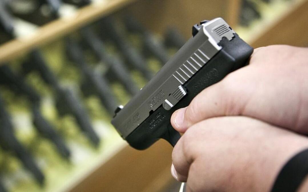 A customer checks out a conceal carry pistol at the Bullet Stop. (June 4, 2013)