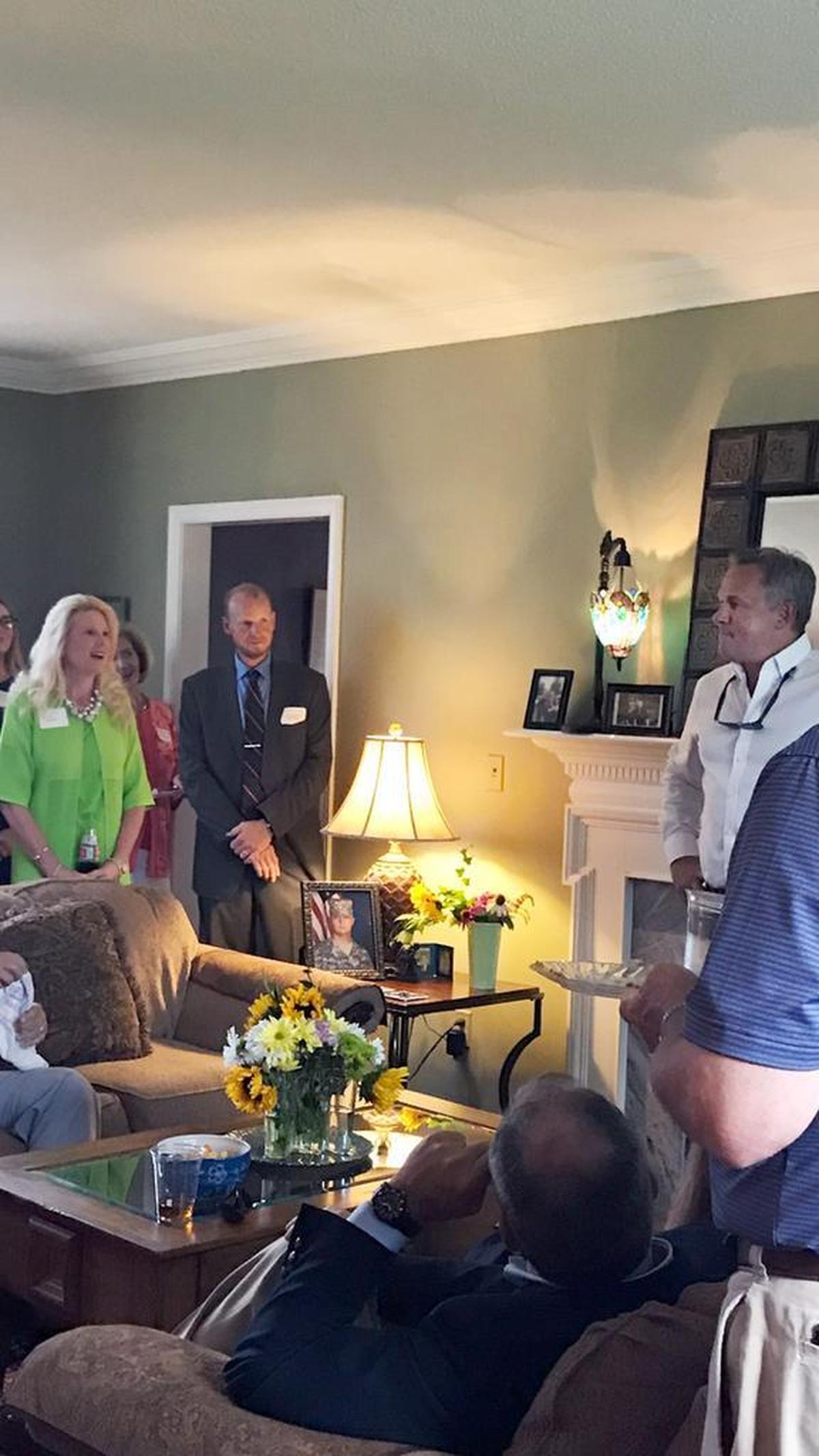 North Carolina Lt. Gov. Dan Forest, right in white shirt, attends a fundraiser in Forest City, NC on July 13, 2017. Also at the event was Robin Webster, left, blonde hair, who is a minister at Word of Faith Fellowship in Spindale, NC. Dozens of former members of Word of Faith Fellowship have accused the church of beating congregants.