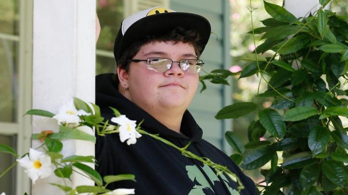 In this Aug. 25, 2015, file photo, Gavin Grimm poses on his front porch during an interview at his home in Gloucester, Va. The fate of North Carolina's new bathroom law could be determined by the 4th U.S. Circuit Court of Appeals in Richmond, which is expected to rule soon on Grimm's challenge. The high school student was born female but identifies as male, and says it's discriminatory to make him use the girls room or a single-stall unisex restroom.