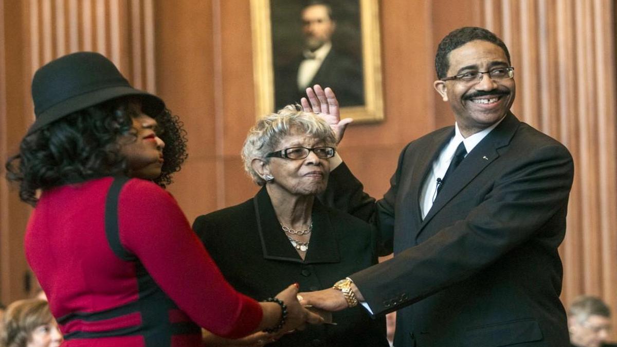 Supreme Court of North Carolina associate justice Mike Morgan takes the oath as his wife Audrey Morgan, left, and his mother Barbara Morgan look on Monday, Jan. 4, 2017 during a swearing in ceremony at the Law and Justice Building in Raleigh. Justice Morgan is the 99th associate justice of the Supreme Court.