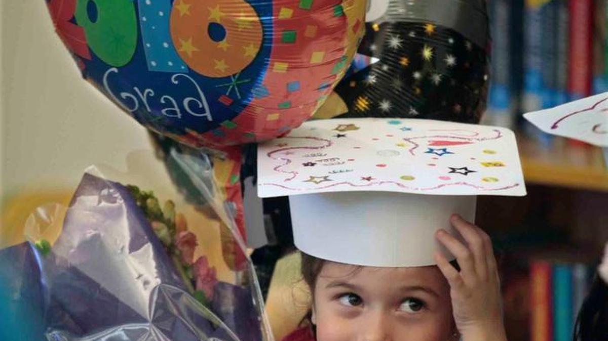 Pre-K grad Zoe Betancourt woke up, her parents Joe and Jasmin Betancourt say, 'feeling like a princess' so after her Pre-K graduation at Aversboro Elementary School in Garner Thursday, June 9, 2016, she had the Grad Princess sash, flowers and ballons. Aversboro Elementary held a Pre-K graduation ceremony in the school's media center for the parents and 30 kids celebrating the kids' first year at Aversboro before letting out for the summer.