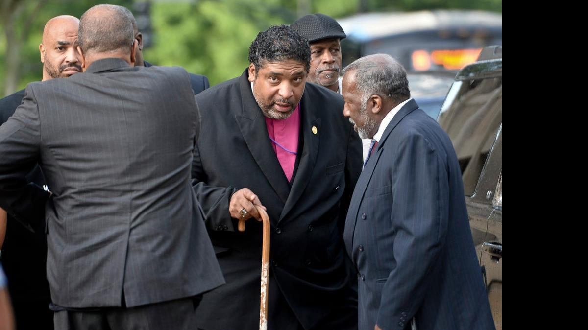 
The Rev. William Barber arrives for the start of the NAACP voting rights trial in federal court in Winston-Salem, NC, Monday, July 13, 2015. The trial challenges voting law changes, including voter ID, introduced by the North Carolina legislature. 
