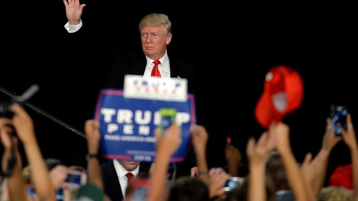 GOP presidential candidate Donald Trump waves to supporters following his speech during a rally at the Charlotte Convention Center in Charlotte, NC on Thursday, August 18, 2016.