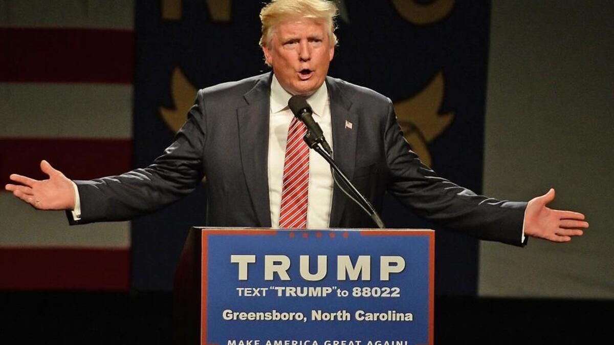 Republican Presidential hopeful Donald Trump gestures during his speech at the Greensboro Coliseum in the Greensboro Special Events Center in Greensboro, N.C. Tuesday, June 14, 2016.