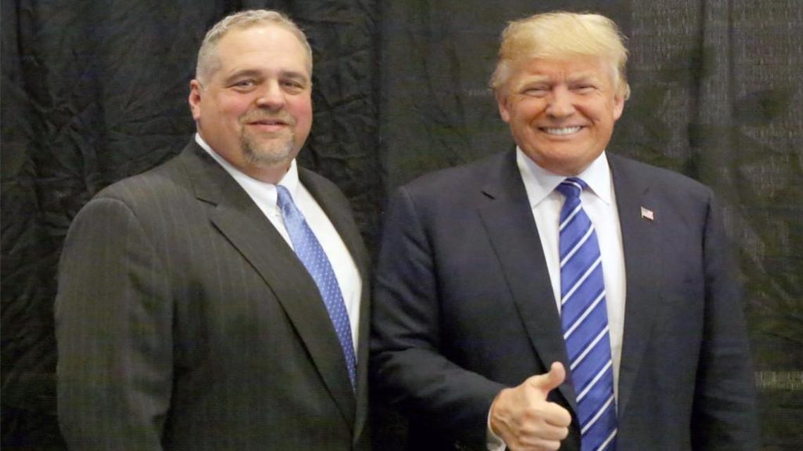 Wake County Republican Party leader Charles Hellwig, poses with Donald Trump at a recent campaign event. Hellwig will attend the inauguration, but said he’s not sticking around Washington for the “social stuff.”