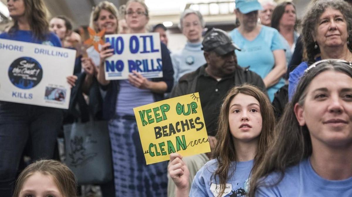 President Joe Biden moved Monday to permanently ban new offshore oil and gas leases in federal waters off of the entire U.S. East Coast, including North Carolina. Here, opponents of offshore drilling are shown after a 2018 meeting the Bureau of Ocean Energy Management held at the Hilton North Raleigh Midtown Hotel.